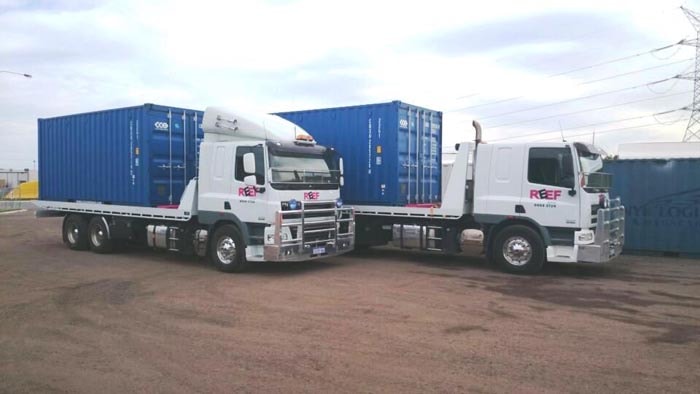 Two Tilt Tray Truck Transporting Sea Container in Perth WA